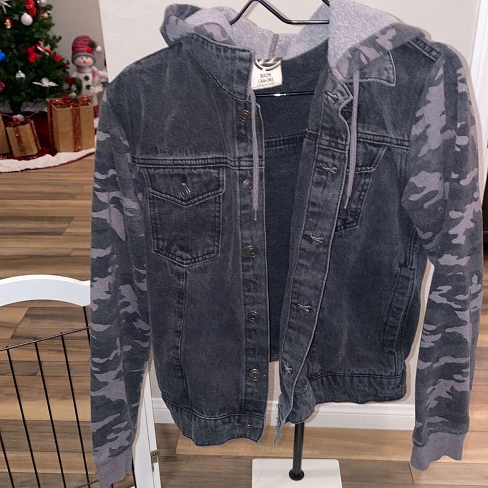 Woman’s size large jean jacket with attached camo printed hood and sleeves